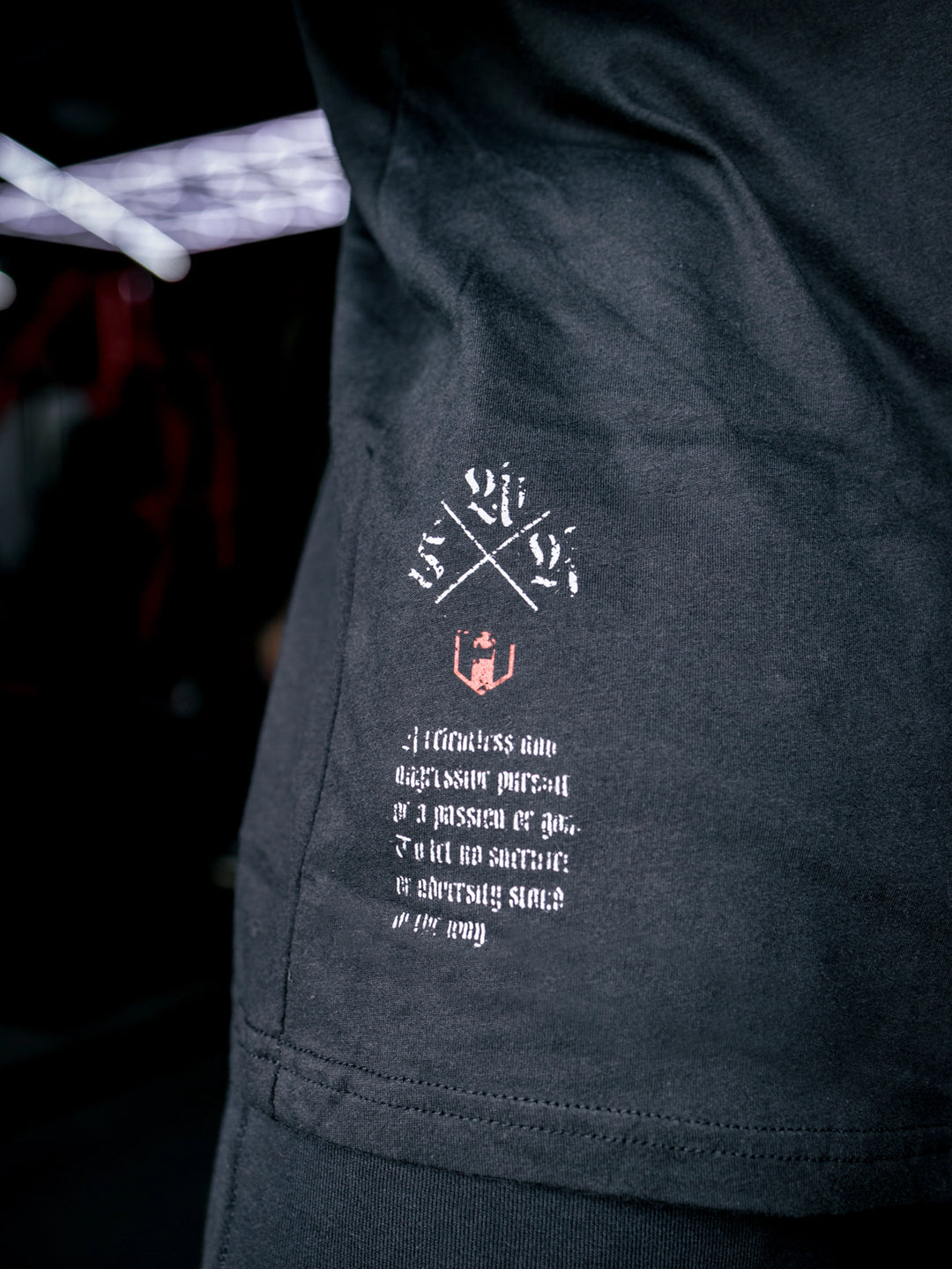 Martin Fitzwater wearing the Insignia t-shirt in a gym#color_black