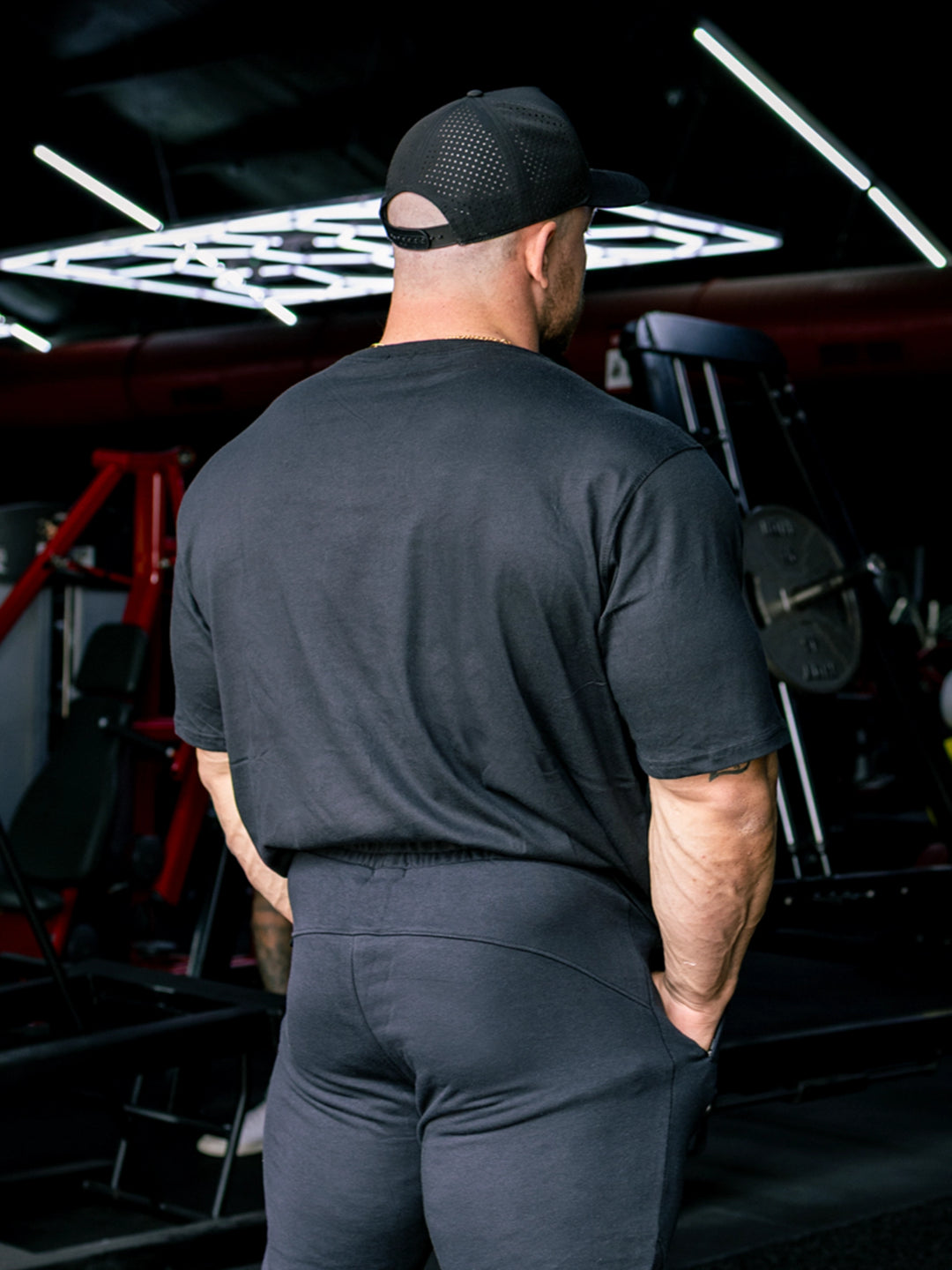 Martin Fitzwater wearing the Insignia t-shirt in a gym#color_black