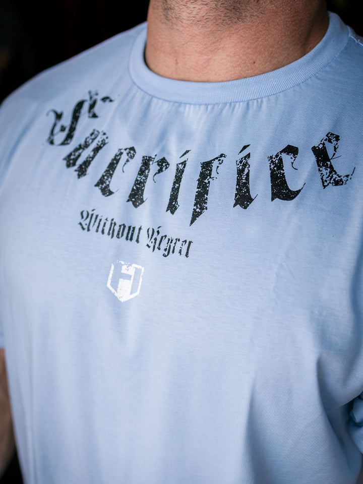 Martin Fitzwater wearing the Insignia t-shirt in a gym#color_ice-blue