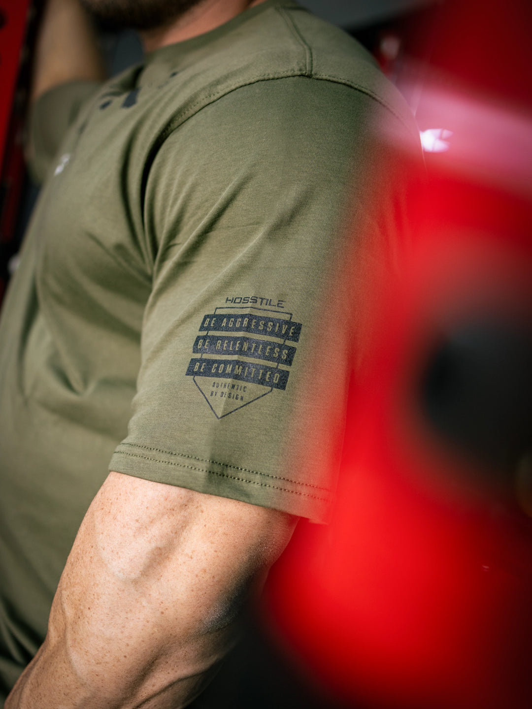 Martin Fitzwater wearing the Insignia t-shirt in a gym#color_military-green