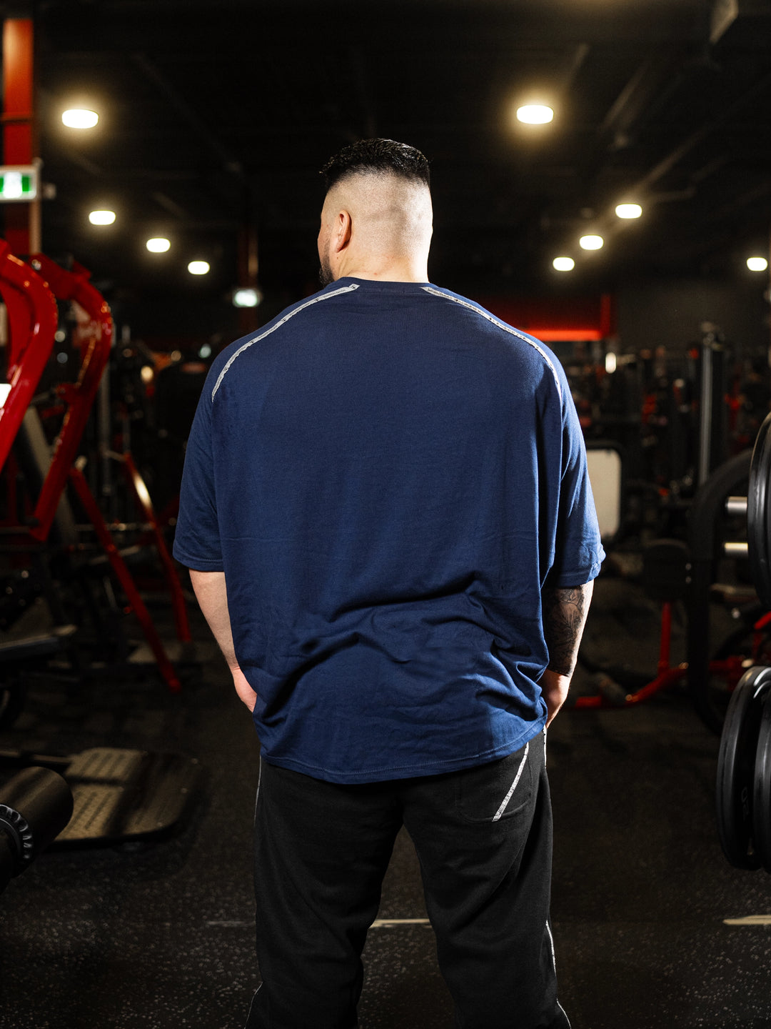 Bodybuilder wearing Samson Dauda Lion Oversized Tee