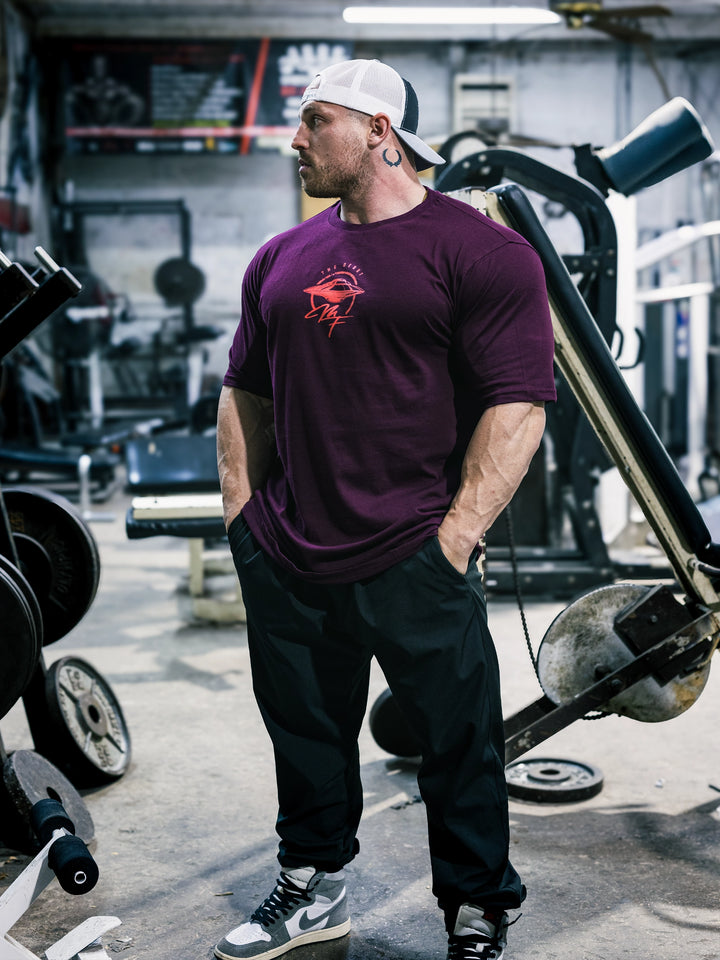 Bodybuilder Martin Fitzwater wearing the MF Vintage T-Shirt in the gym#color_dark-maroon