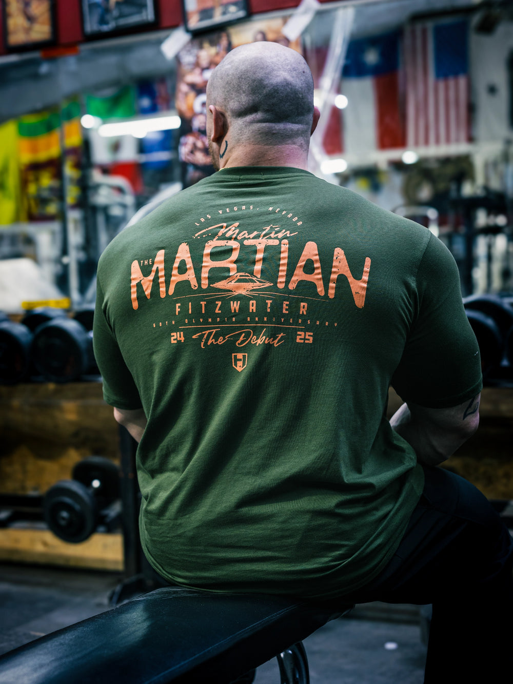 Bodybuilder Martin Fitzwater wearing the MF Vintage T-Shirt in the gym#color_forest-green