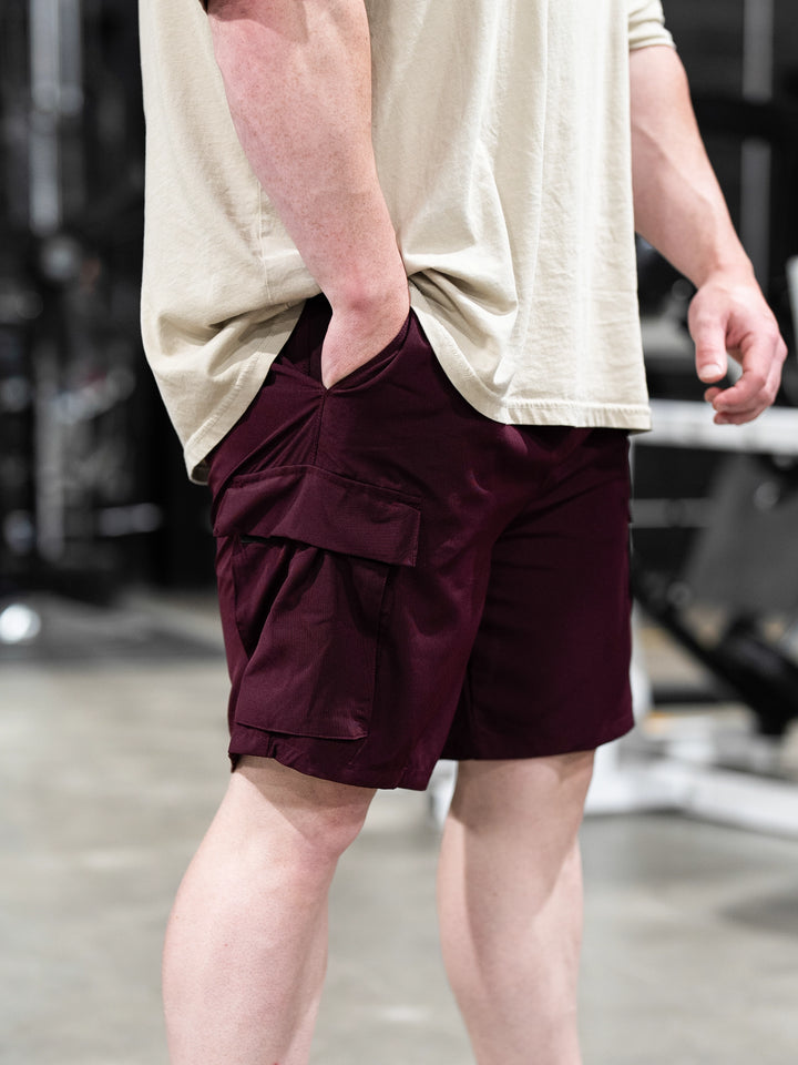 Bodybuilder Wearing Shield Gym Cargo Shorts - Maroon#color_maroon
