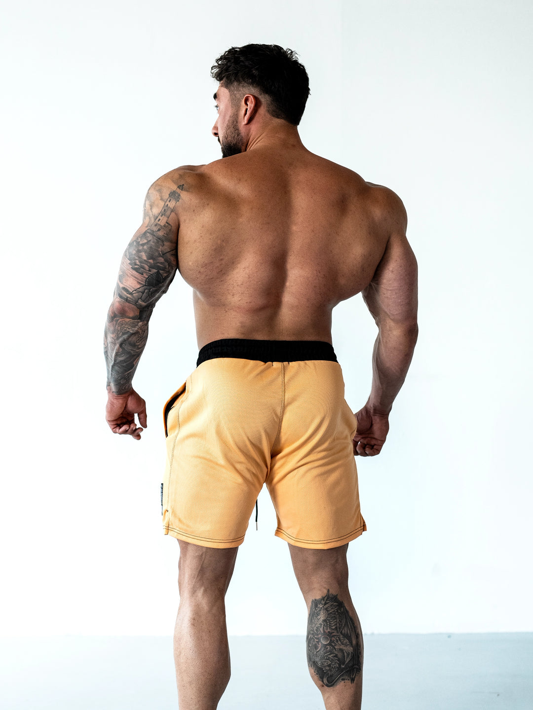 Bodybuilder Wearing Sacrifice Mesh Training Shorts#color_coral