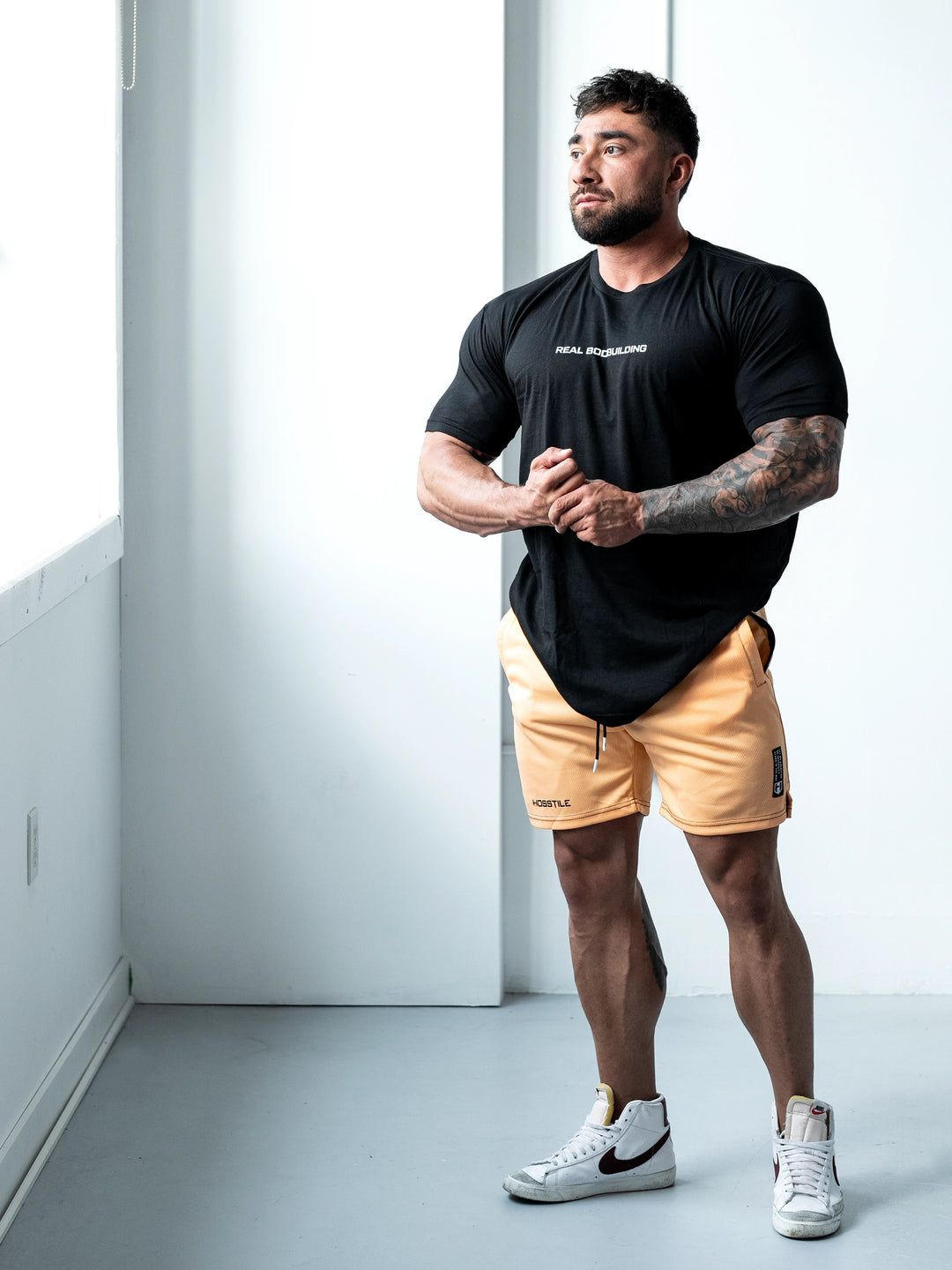 Bodybuilder Wearing Sacrifice Mesh Training Shorts#color_coral