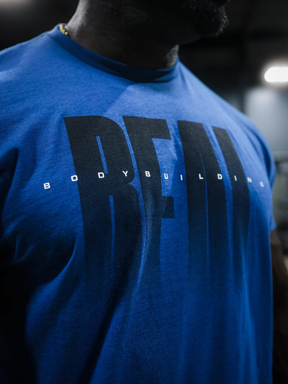 Real Classic Workout Tee Model Bodybuilder Samson Dauda#color_heather-cool-blue