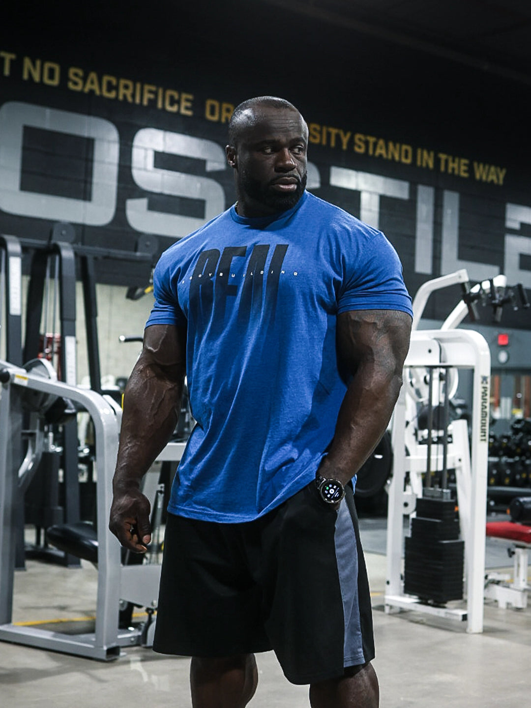 Real Classic Workout Tee Model Bodybuilder Samson Dauda#color_heather-cool-blue