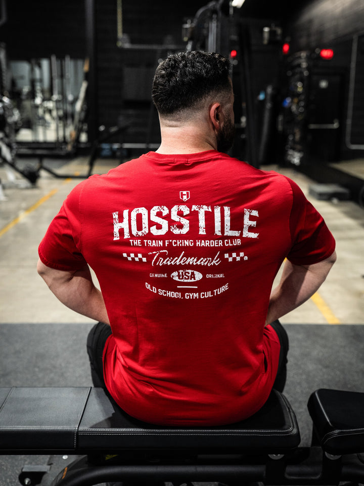 Bodybuilder wearing the Hosstile Club Work Tee#color_red