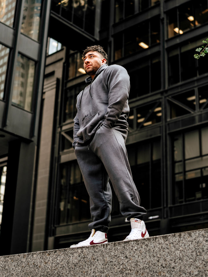 Bodybuilder Wearing Relaxed Gym Hoodie#color_gunship-grey