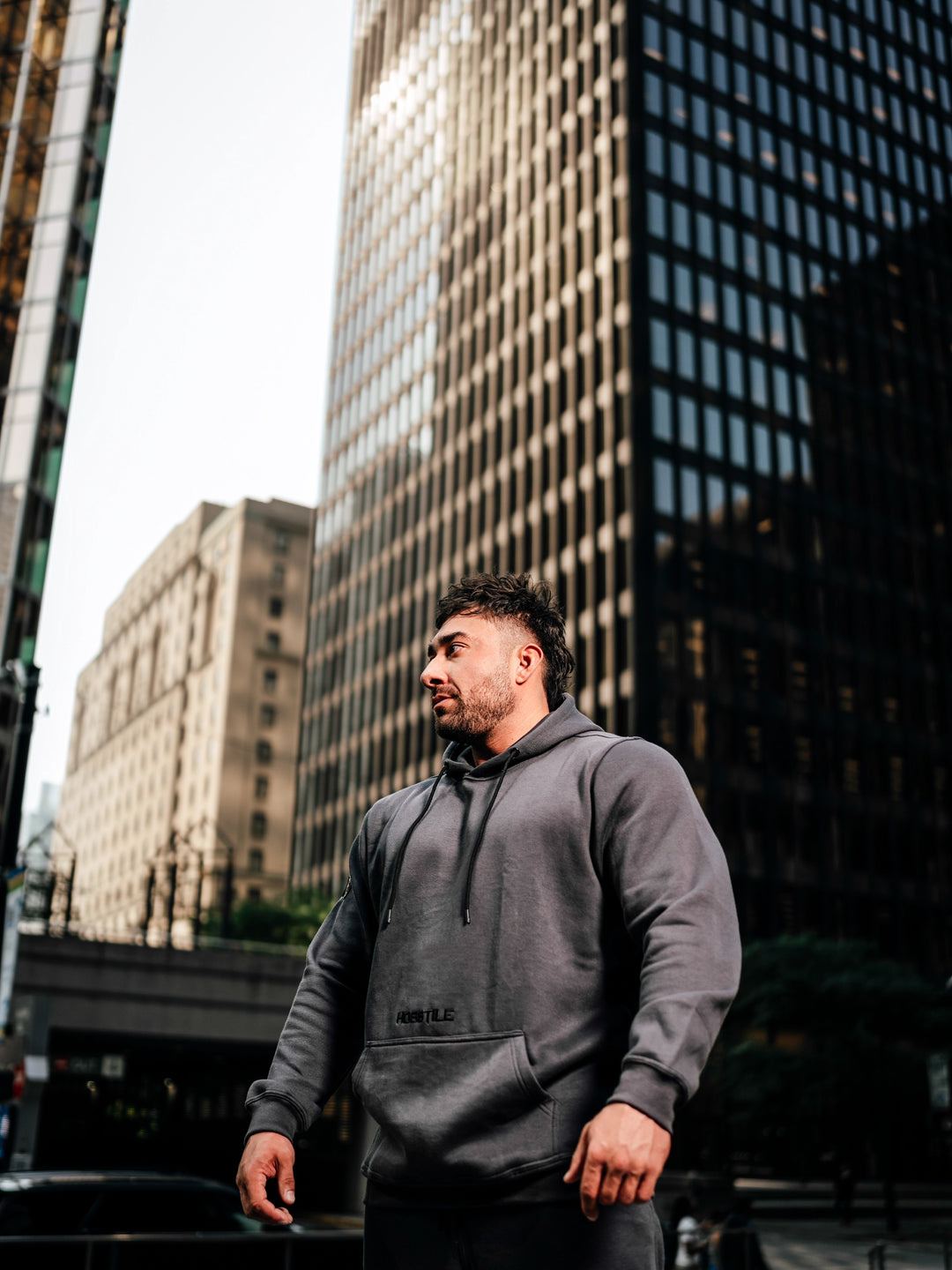 Bodybuilder Wearing Relaxed Gym Hoodie#color_gunship-grey