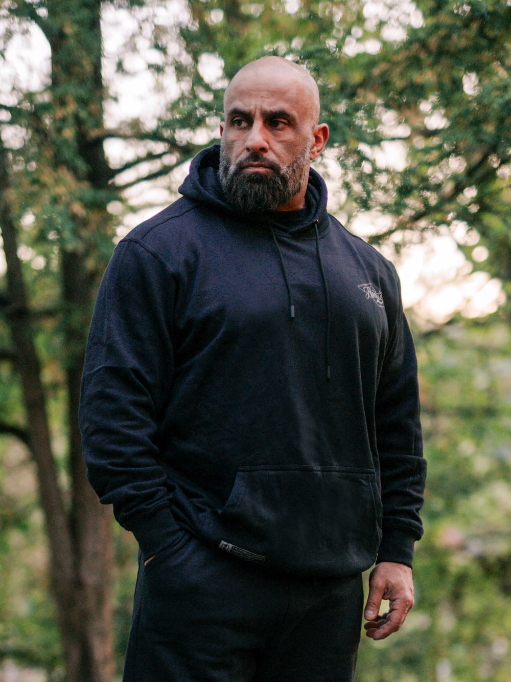 Bodybuilder wearing the Retro Select Workout Hoodie#color_black