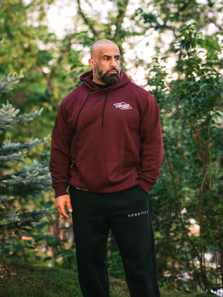 Bodybuilder wearing the Retro Select Workout Hoodie#color_deep-cherry