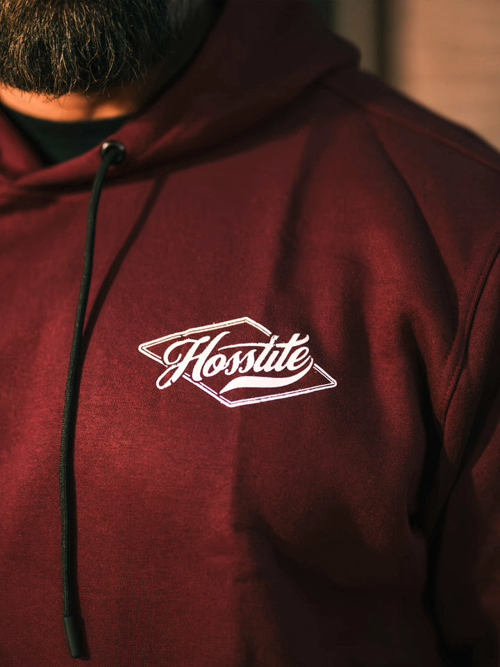 Bodybuilder wearing the Retro Select Workout Hoodie#color_deep-cherry