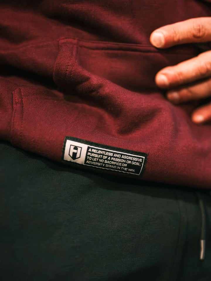 Bodybuilder wearing the Retro Select Workout Hoodie#color_deep-cherry