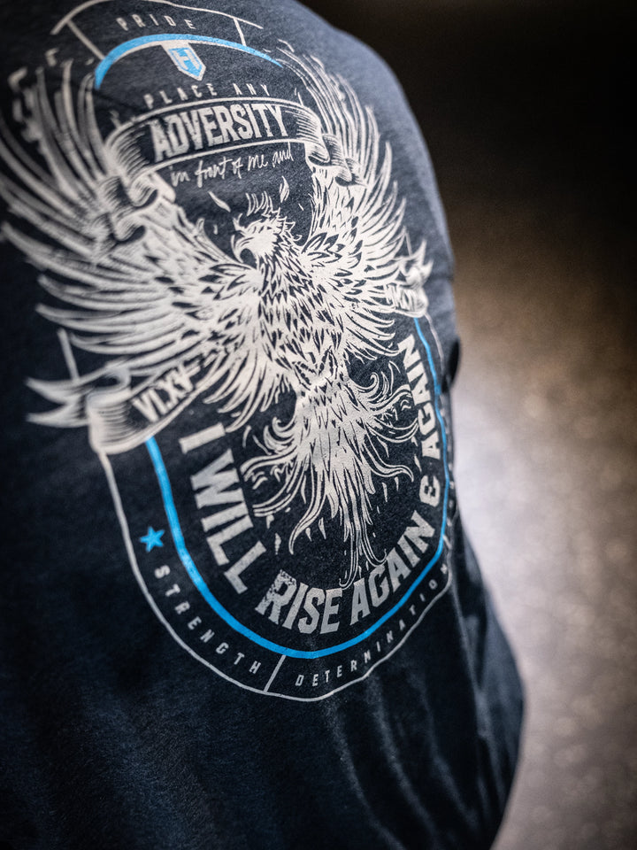 Navy t-shirt with a phoenix design and motivational text on a dark background#color_navy