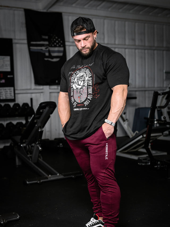bodybuilder wearing the Rose & Thorn Men's Graphic Gym T-Shirt#color_black