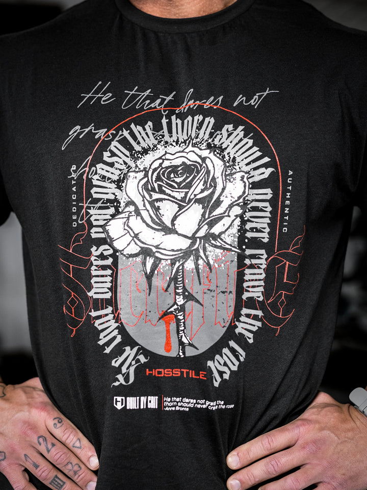 bodybuilder wearing the Rose & Thorn Men's Graphic Gym T-Shirt#color_black