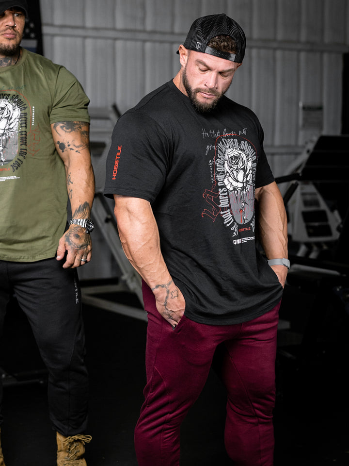 bodybuilder wearing the Rose & Thorn Men's Graphic Gym T-Shirt#color_black