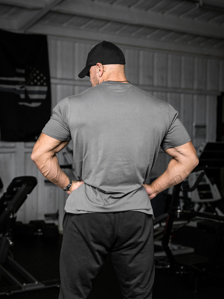 bodybuilder wearing the Rose & Thorn Men's Graphic Gym T-Shirt#color_grey