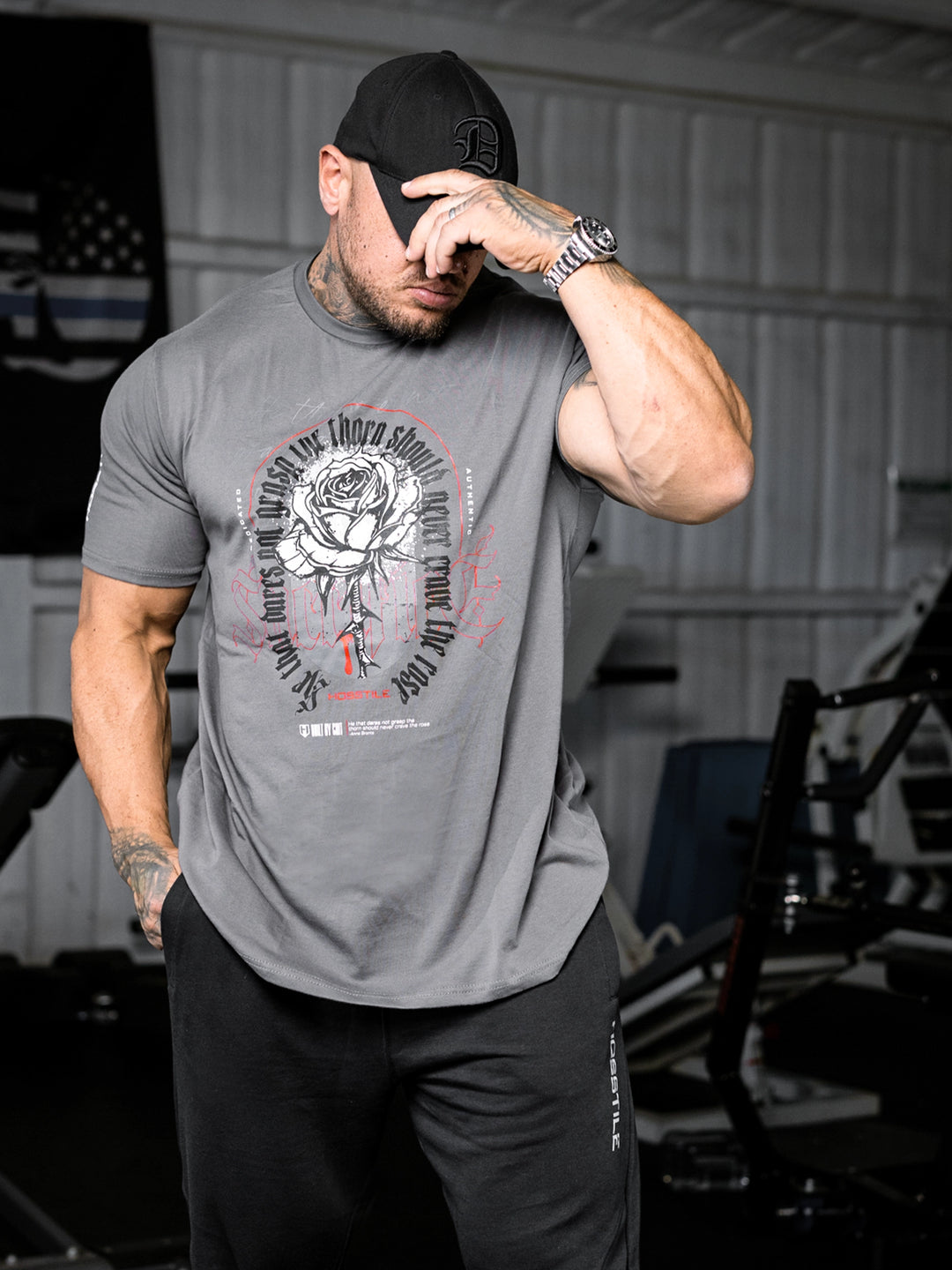 bodybuilder wearing the Rose & Thorn Men's Graphic Gym T-Shirt#color_grey