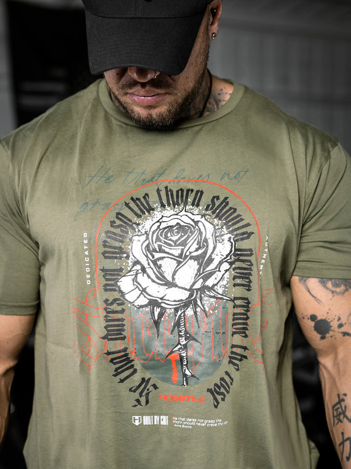 bodybuilder wearing the Rose & Thorn Men's Graphic Gym T-Shirt#color_military-green