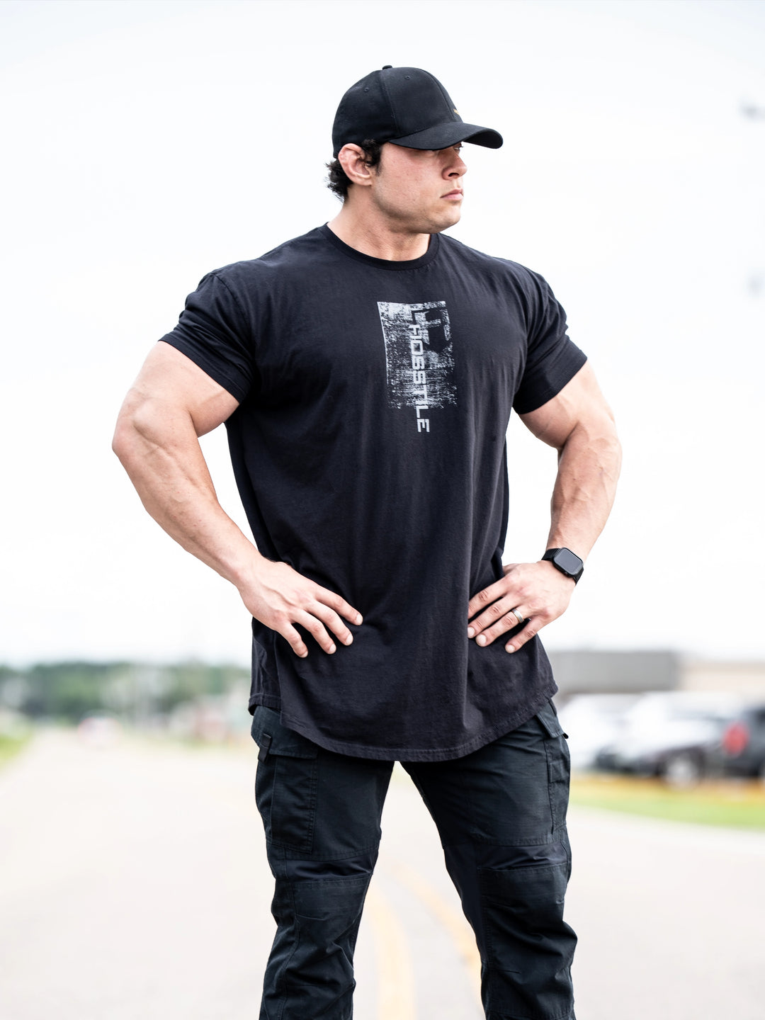 Bodybuilder wearing Sacrifice Long Body T-Shirt#color_black