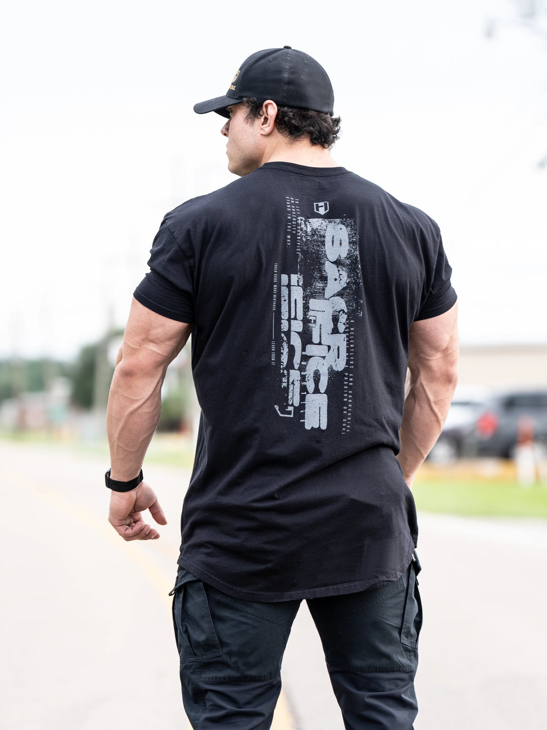 Bodybuilder wearing Sacrifice Long Body T-Shirt#color_black