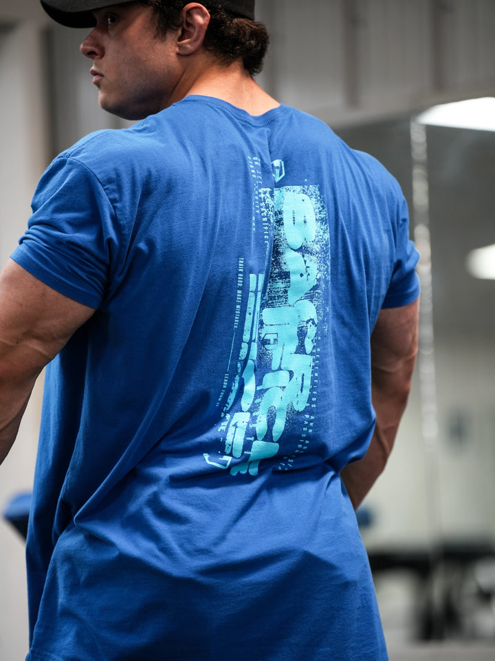 Bodybuilder wearing Sacrifice Long Body T-Shirt#color_royal-blue