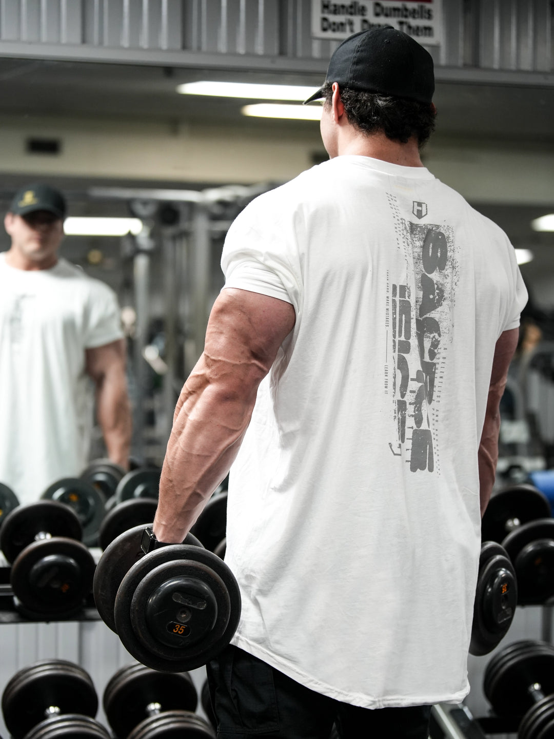 Bodybuilder wearing Sacrifice Long Body T-Shirt#color_white