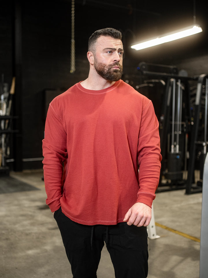 Bodybuilder wearing Shield Thermal Shirt#color_flat-red