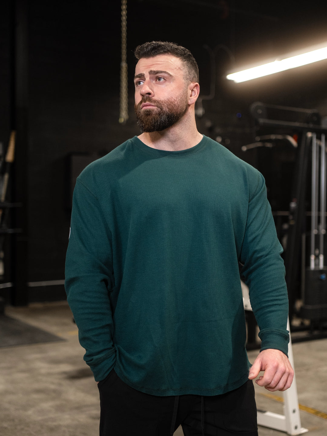 Bodybuilder wearing Shield Thermal Shirt#color_forest-green