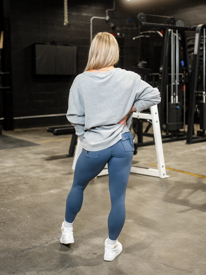 Fitness model wearing Shield Thermal Shirt#color_athletic-heather-grey