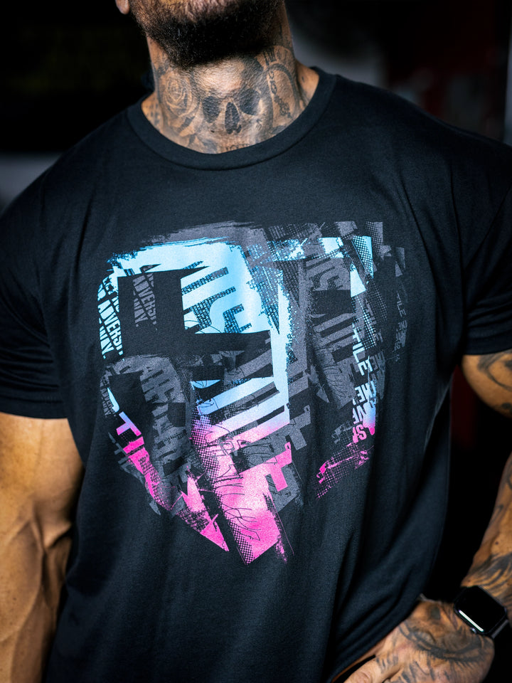 Bodybuilder Ben Chow wearing a black t-shirt with a graphic design and a cap, standing in a gym.#color_black-miami-vice
