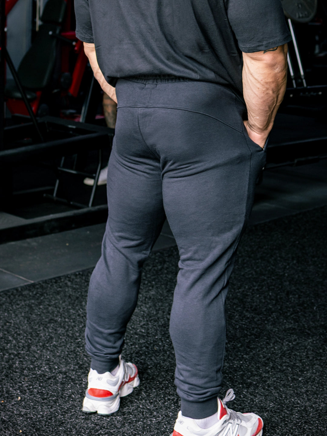 Martin Fitzwater wearing joggers in the gym#color_black