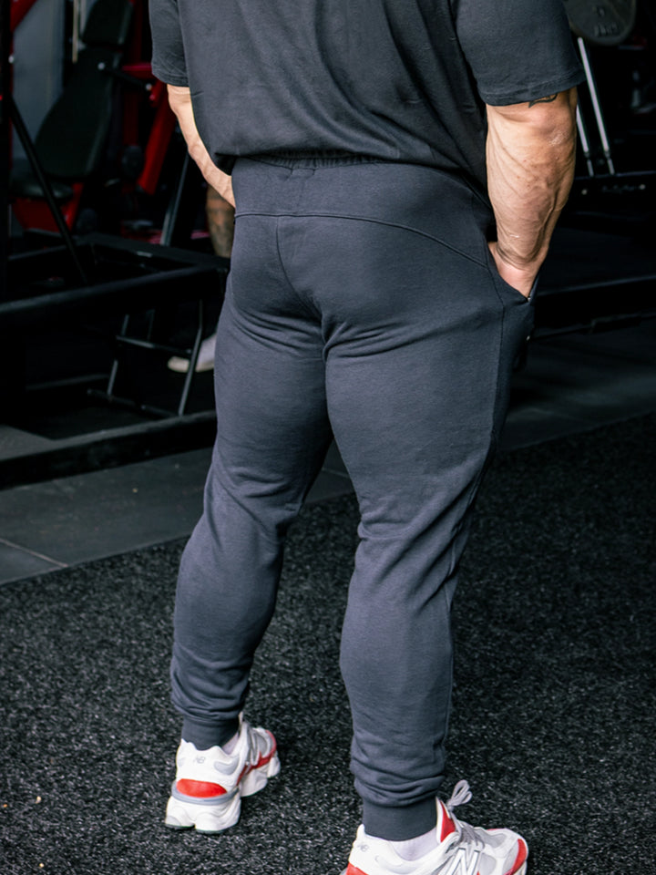 Martin Fitzwater wearing joggers in the gym#color_black