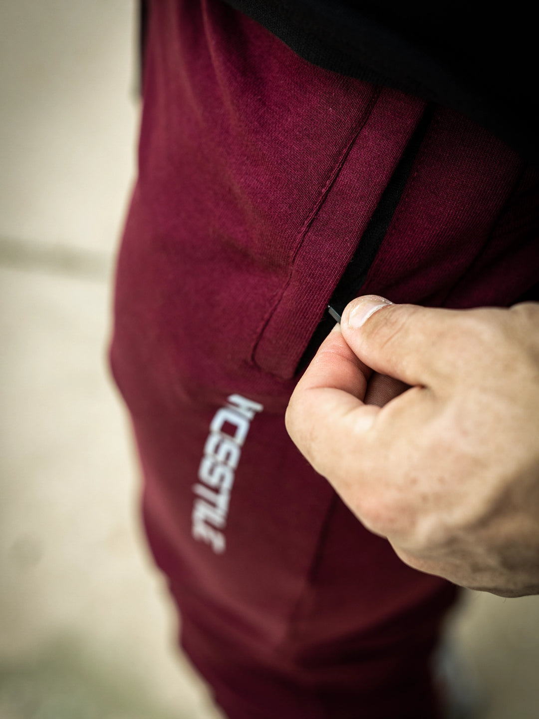 Martin Fitzwater wearing joggers in the gym#color_deep-cherry