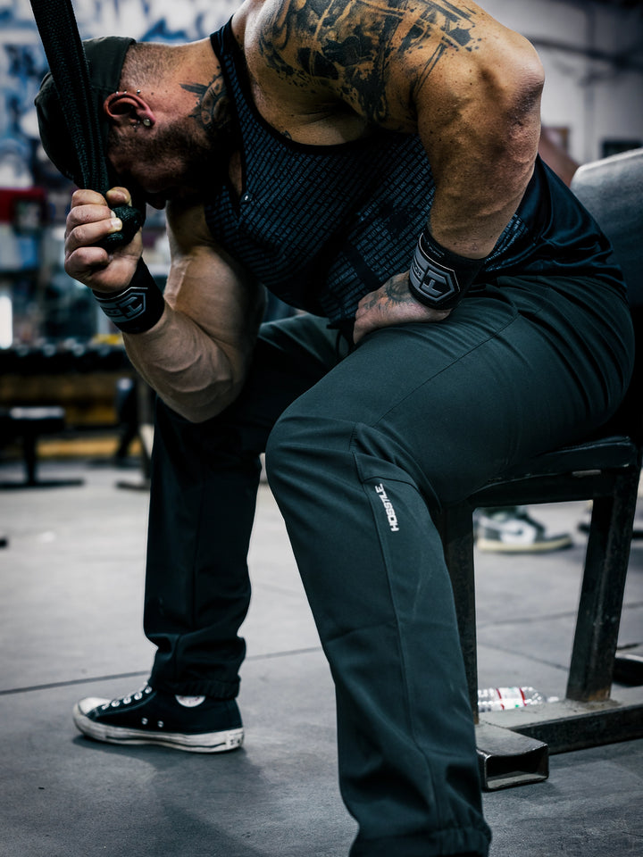 Bodybuilder Martin Fitzwater wearing the Utility Joggers in the gym#color_black