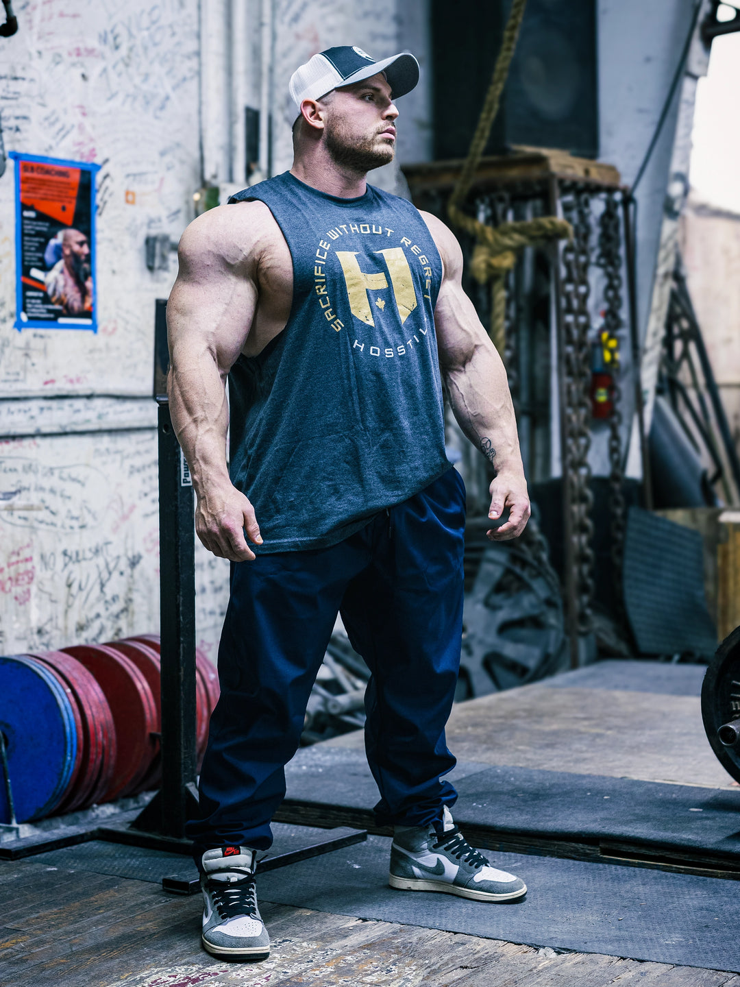 Bodybuilder Martin Fitzwater wearing the Utility Joggers in the gym#color_navy