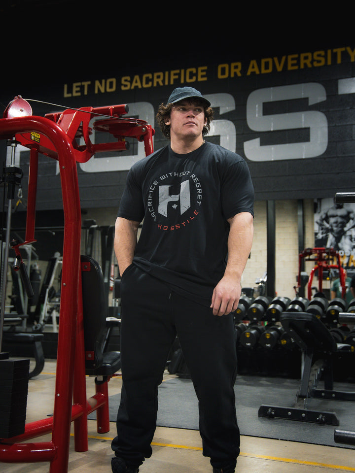 Sam Sulek Bodybuilder wearing OG Sacrifice Classic Workout T-Shirt#color_black