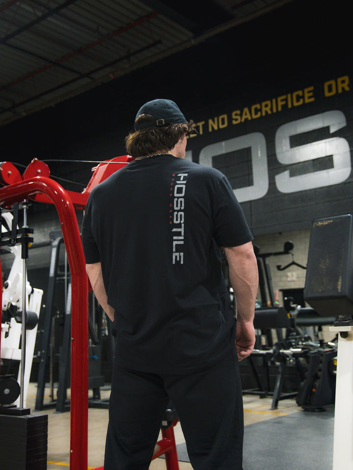 Sam Sulek Bodybuilder wearing OG Sacrifice Classic Workout T-Shirt#color_black