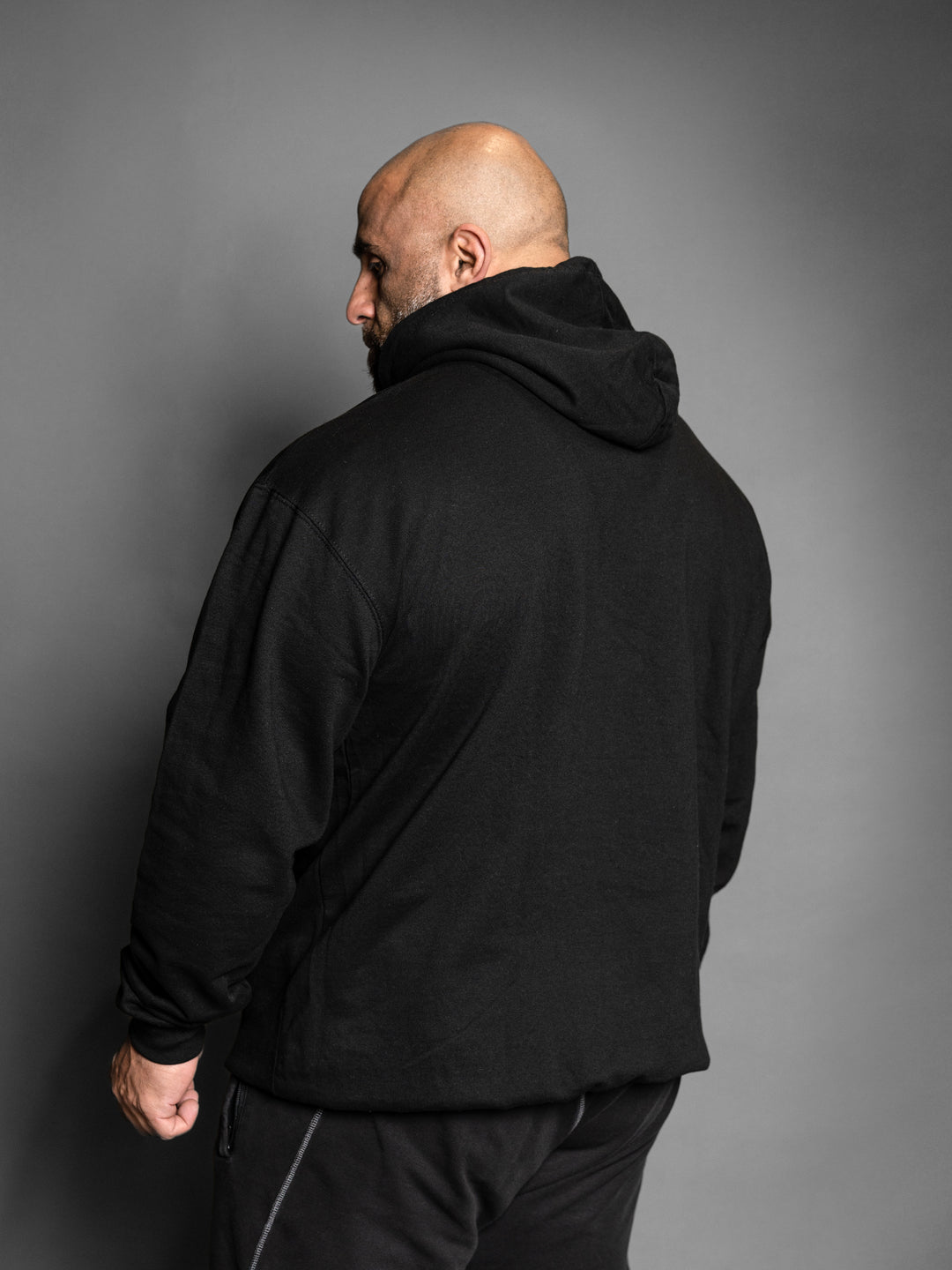 Hosstile Logo Block Pullover Hoodie Sweatshirt Black Model Bodybuilder Fouad Abiad#color_black