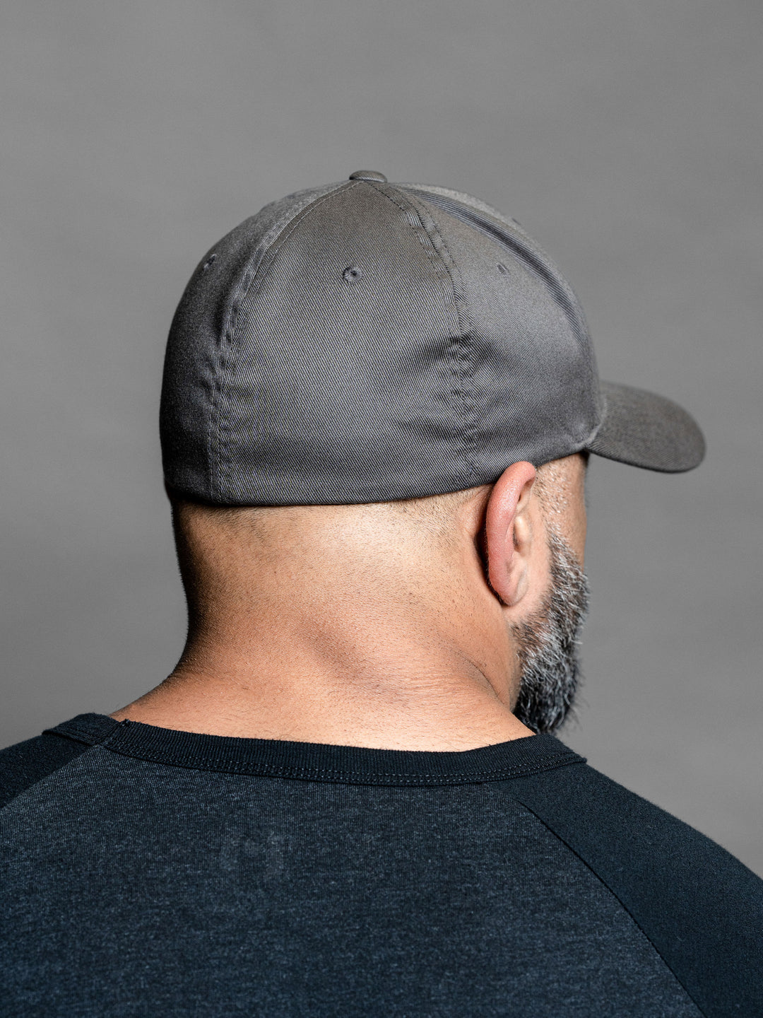 Hosstile Shield FlexFit Hat Dark Grey - Model Bodybuilder Fouad Abiad#color_dark-grey