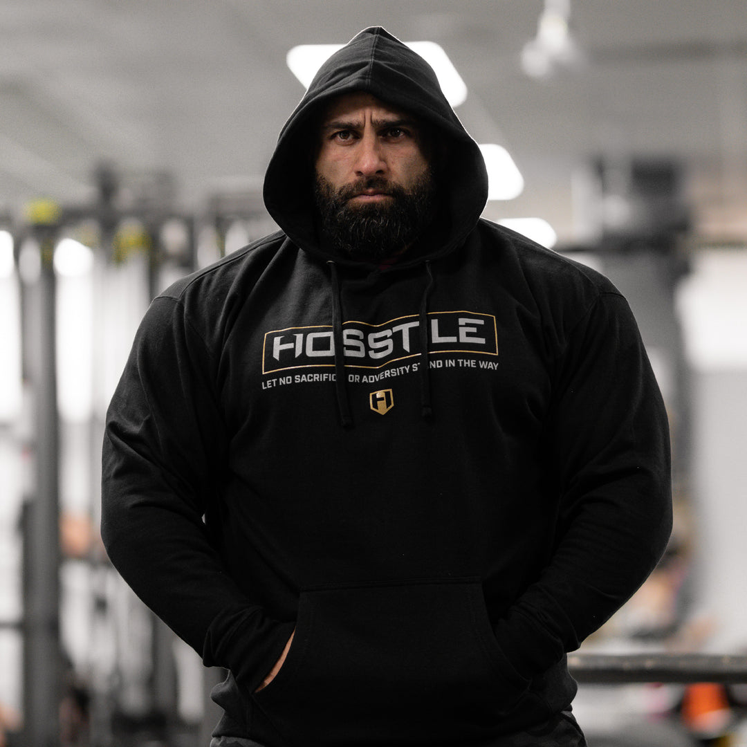 Bodybuilder Fouad Abiad wearing Hosstile Signature hoodie in black#color_black